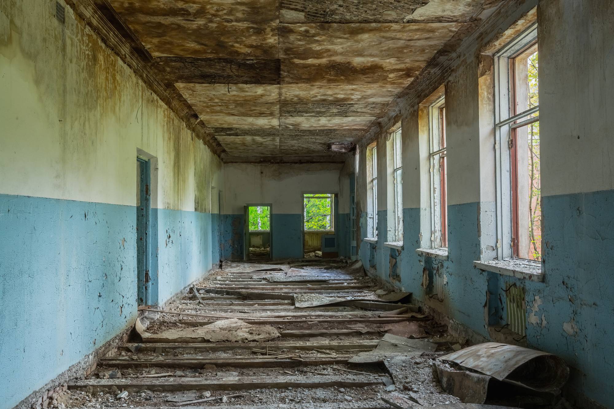 ruined-long-corridor-of-abandoned-school-after-P3L4ZAY